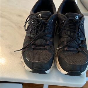 On Running Black Athletic Shoes with Sturdy Sole